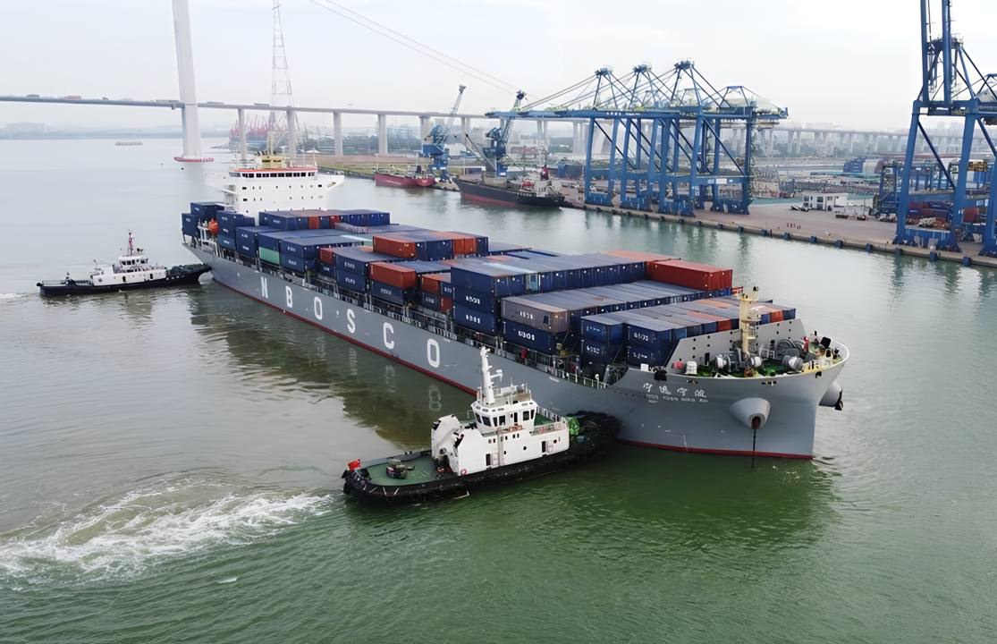 Target container ship Ning Yuan under tug escort in port